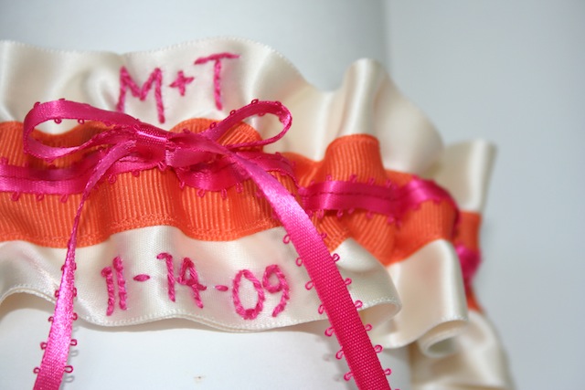  here is an orange and hot pink wedding garter that i recently designed 