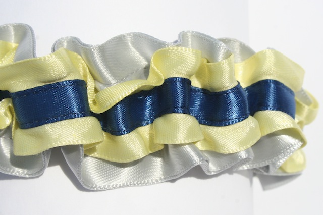 this custom wedding garter is sliver satin with yellow ruffled edge satin