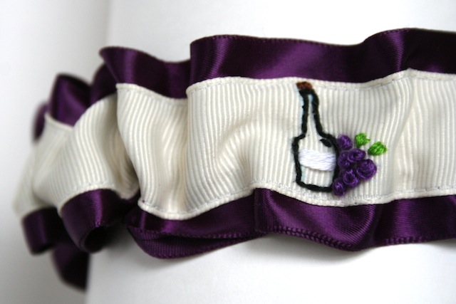 wine themed hand embroidered deep purple and ivory wedding garter by the 